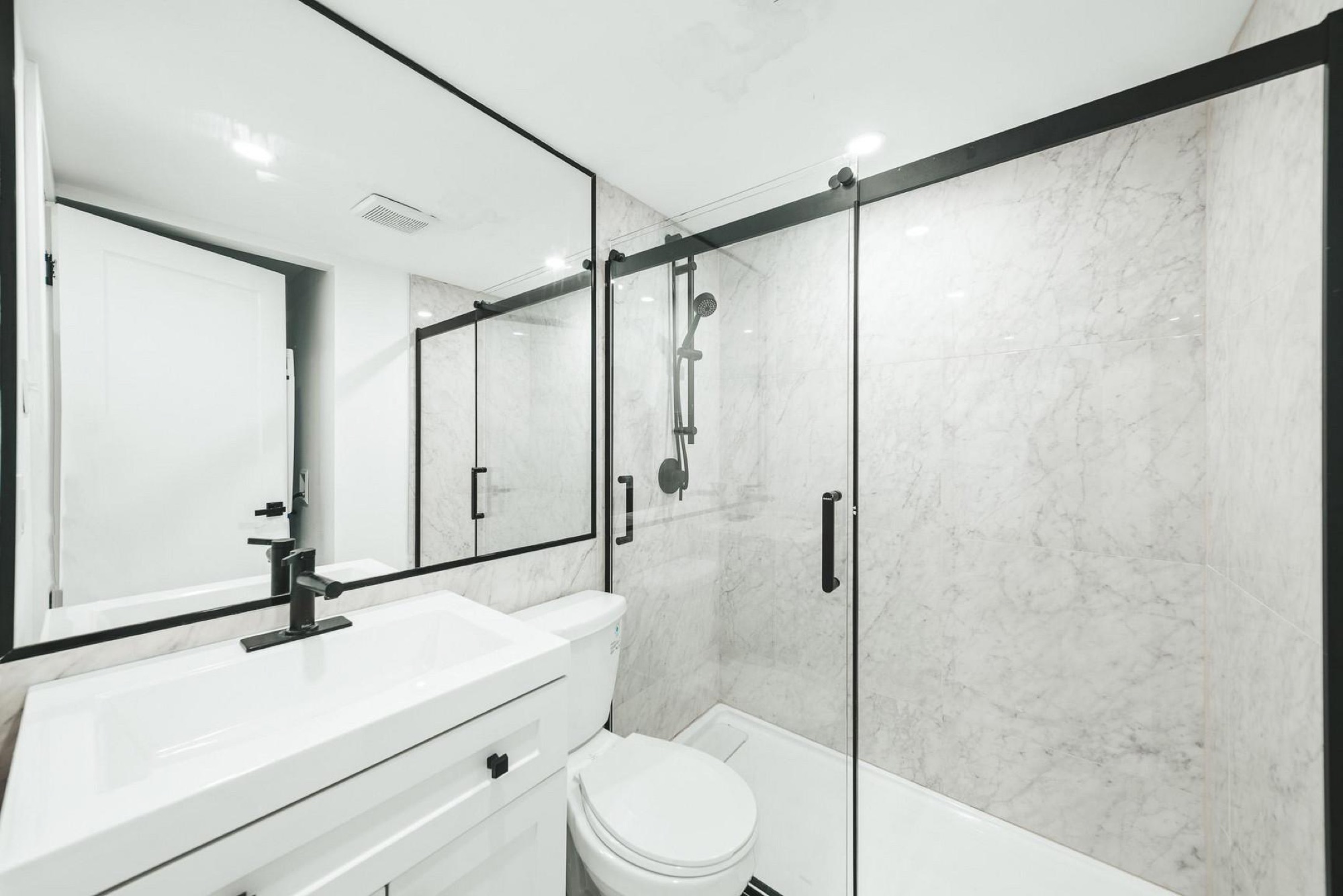 Renovated bathroom with glass shower at Domaine Pelican