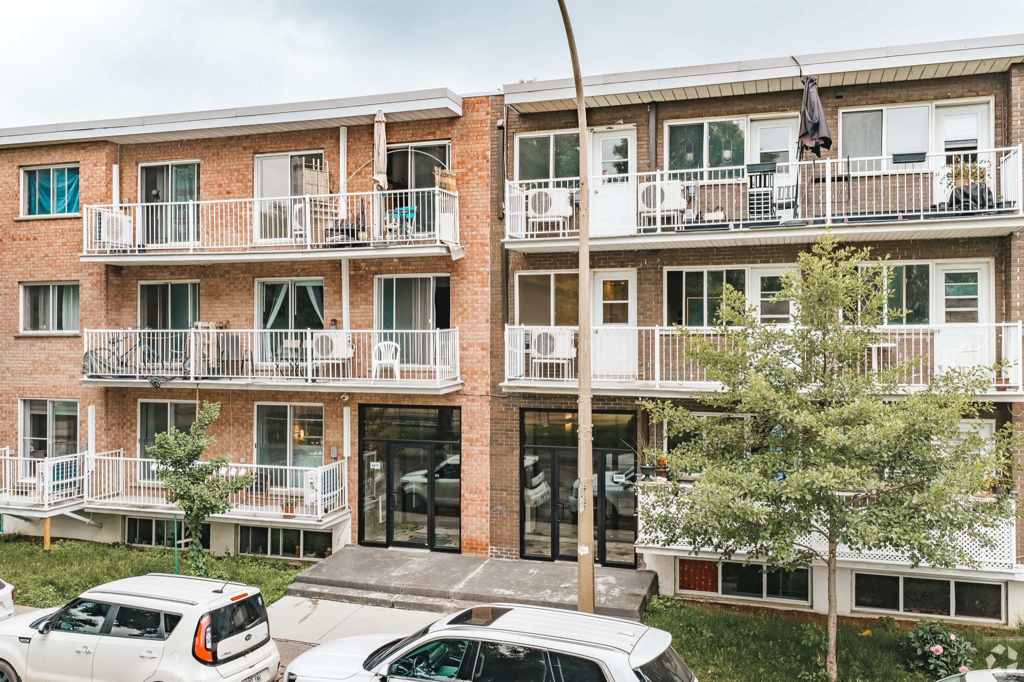 Domaine Pelican brick building with balconies